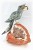 Grey Crystal Parrot on White Quartz Crystal Base. Gemstone Sculpture.