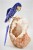 Blue Crystal Parrot on White Quartz Base. Gemstone Sculpture